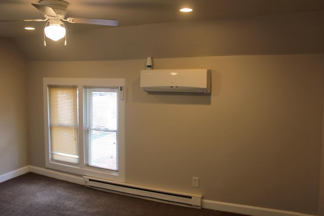 unfurnished room with ceiling fan, a baseboard radiator, a wall unit AC, vaulted ceiling, and dark carpet