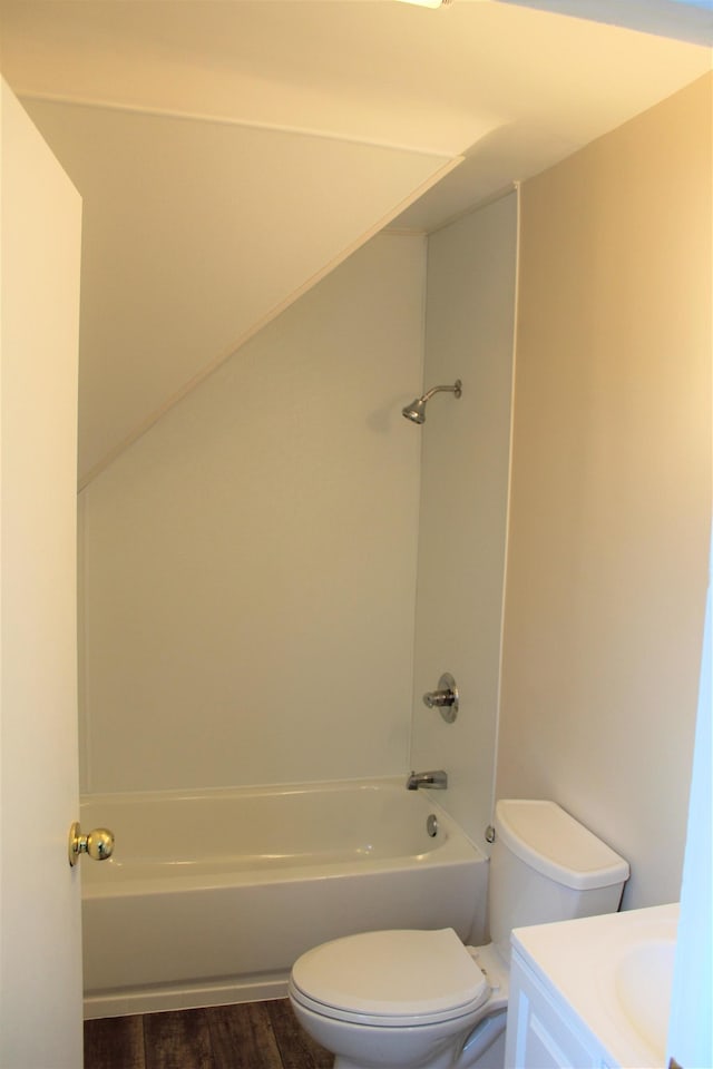 full bathroom with vanity, toilet, wood-type flooring, and tub / shower combination