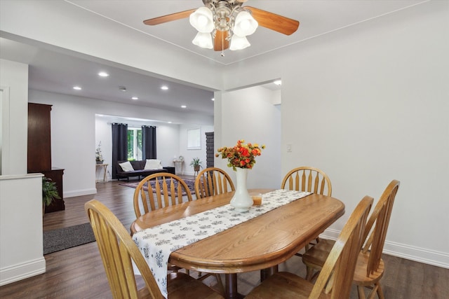 dining room featuring ceiling fan and dark hardwood / wood-style flooring