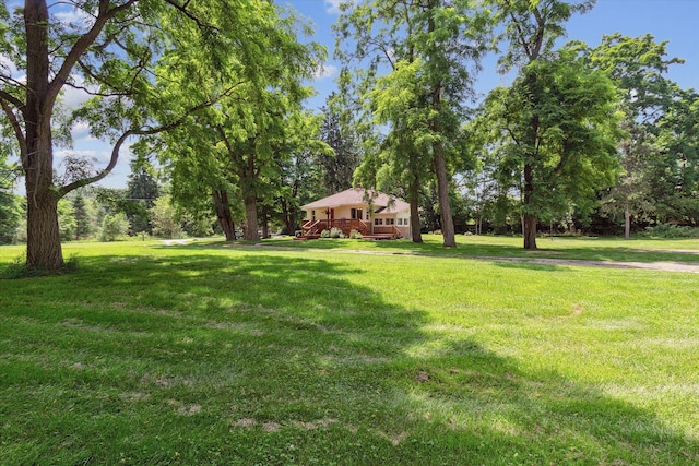 view of yard with a wooden deck