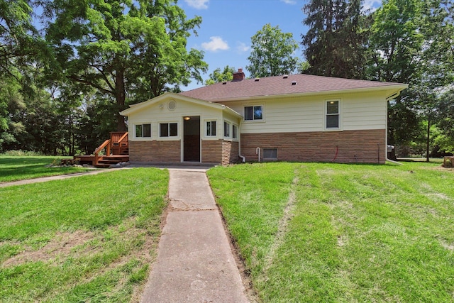 ranch-style home with a front lawn