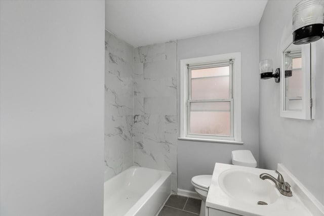 full bathroom featuring toilet, vanity, tile patterned floors, and tiled shower / bath combo