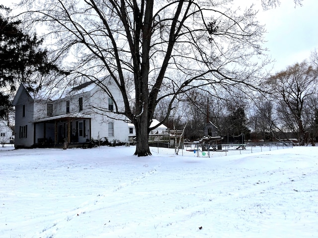 view of yard layered in snow