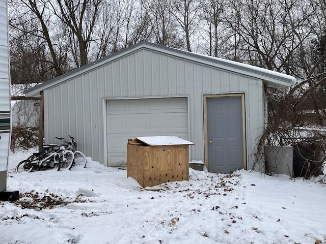 view of snow covered garage