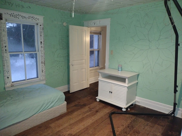 bedroom featuring dark wood-type flooring