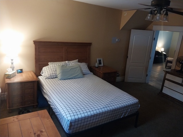 bedroom featuring dark hardwood / wood-style floors and ceiling fan