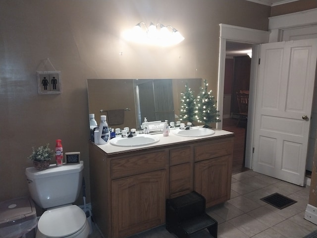 bathroom with tile patterned floors, vanity, and toilet