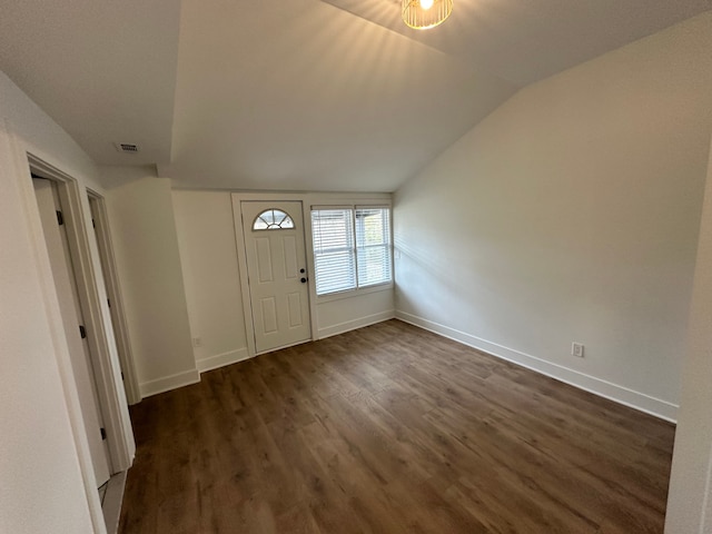 entryway featuring vaulted ceiling and dark hardwood / wood-style floors