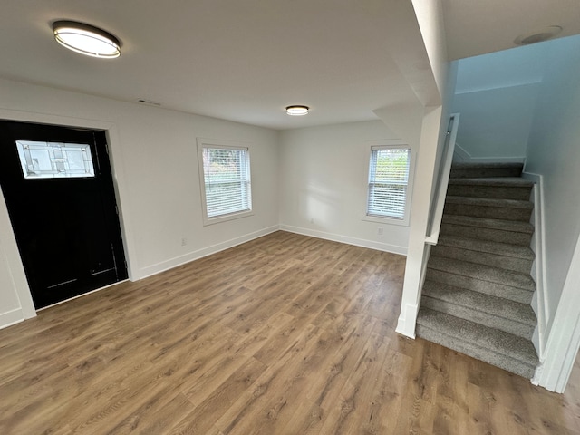 entrance foyer with hardwood / wood-style flooring and a wealth of natural light