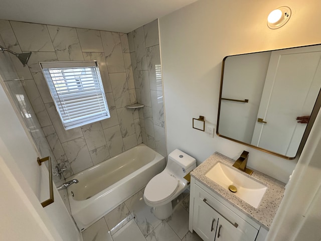 full bathroom with vanity, toilet, and tiled shower / bath