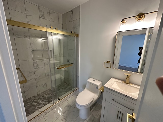 bathroom featuring vanity, a shower with shower door, and toilet