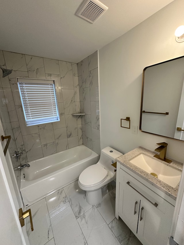 full bathroom featuring vanity, toilet, and tiled shower / bath combo