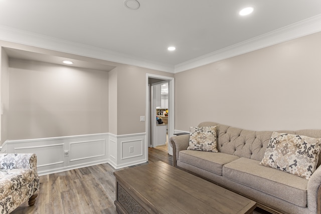 living room featuring crown molding and hardwood / wood-style floors