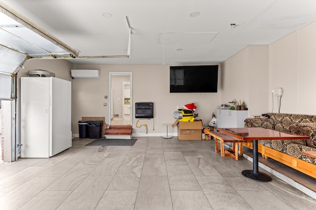 interior space with white refrigerator, heating unit, and a wall mounted AC