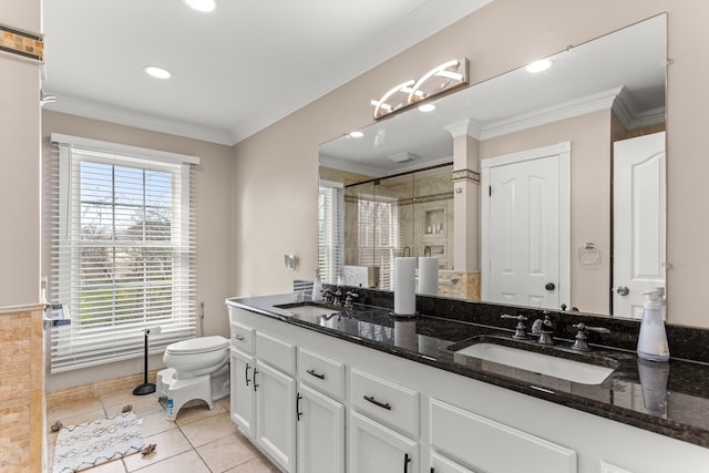 bathroom featuring vanity, tile patterned floors, toilet, ornamental molding, and walk in shower