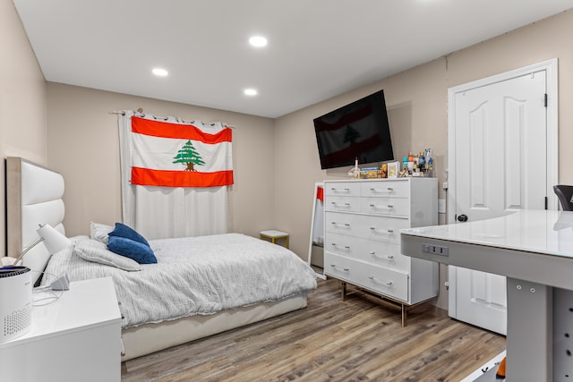 bedroom featuring hardwood / wood-style flooring