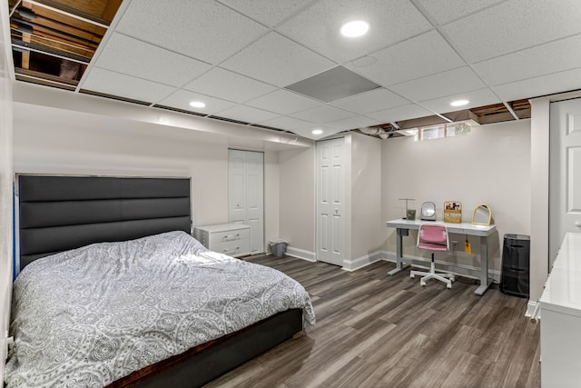 bedroom with a closet and dark hardwood / wood-style floors