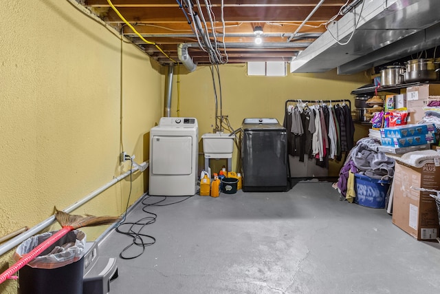 basement featuring washer / clothes dryer and sink