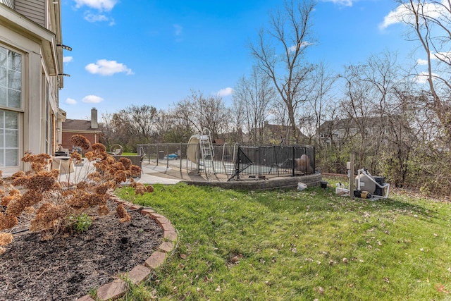 view of yard with a patio area and a swimming pool