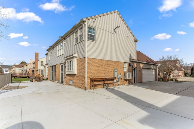 view of side of property with a garage