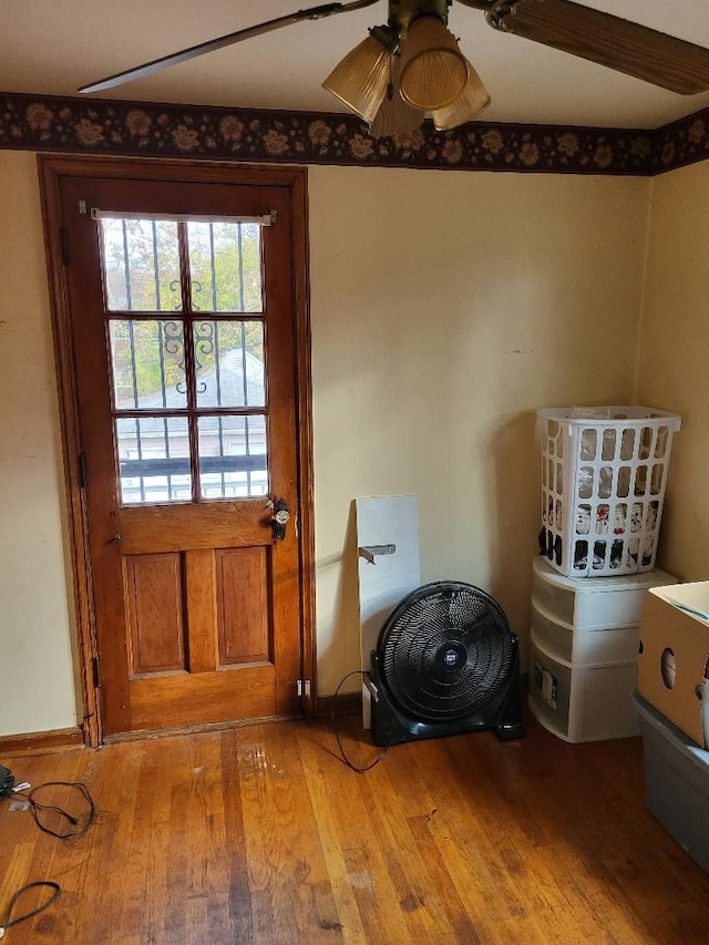 doorway to outside with wood-type flooring