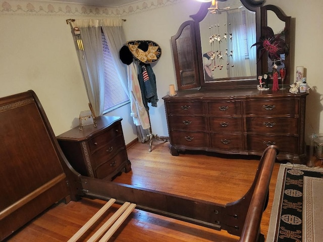 bedroom with hardwood / wood-style floors