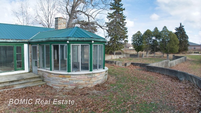 view of yard with a sunroom