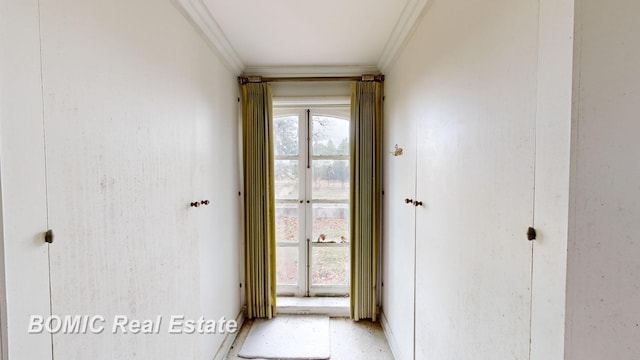 doorway featuring crown molding