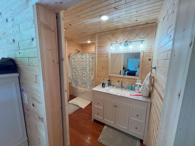 bathroom featuring hardwood / wood-style flooring, wood walls, wooden ceiling, and a shower with shower curtain