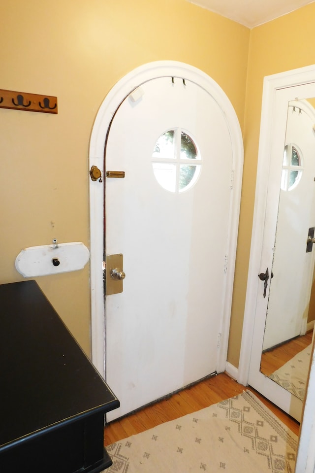 entryway with hardwood / wood-style flooring