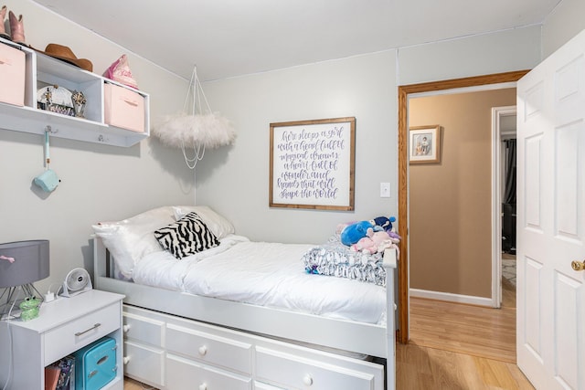 bedroom with light hardwood / wood-style floors