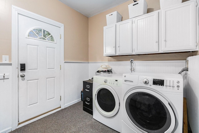 laundry room with washer and dryer and cabinets