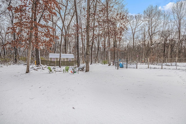 view of yard layered in snow