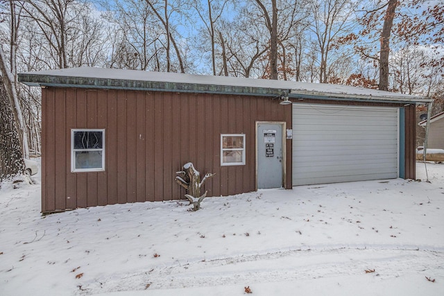 view of snow covered garage