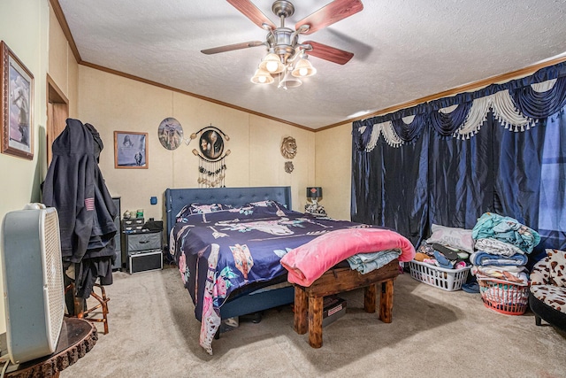 carpeted bedroom featuring a textured ceiling, ceiling fan, and ornamental molding