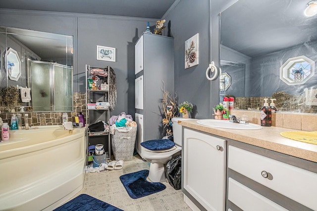 bathroom featuring tasteful backsplash, vanity, crown molding, toilet, and a shower with shower door