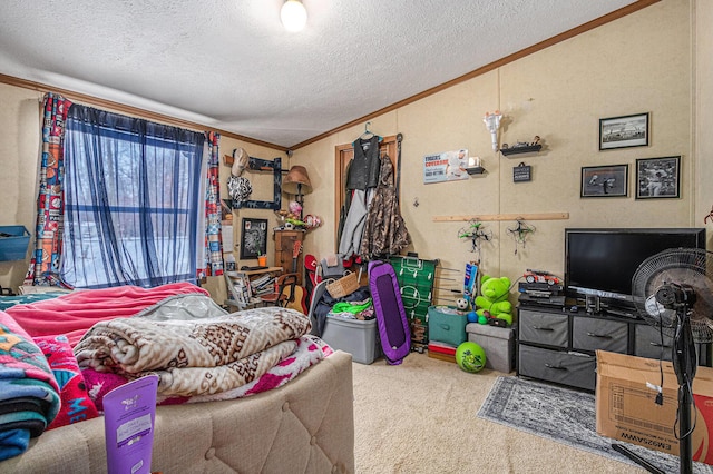 bedroom featuring a textured ceiling, carpet floors, and ornamental molding