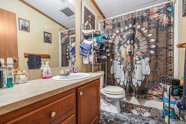 bathroom featuring vanity, toilet, ornamental molding, a textured ceiling, and curtained shower