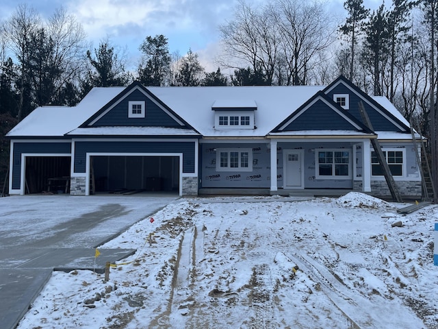 view of front of house with a porch and a garage