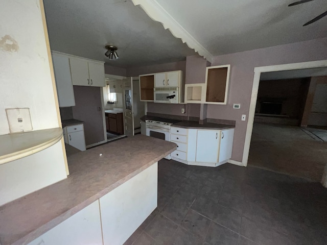 kitchen with ceiling fan, white cabinets, and white appliances