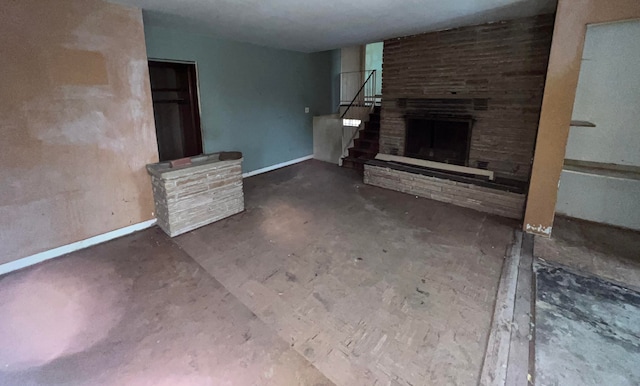 unfurnished living room featuring a large fireplace