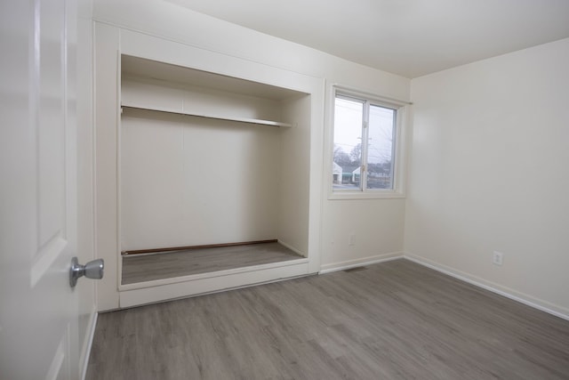 interior space featuring hardwood / wood-style flooring and a closet