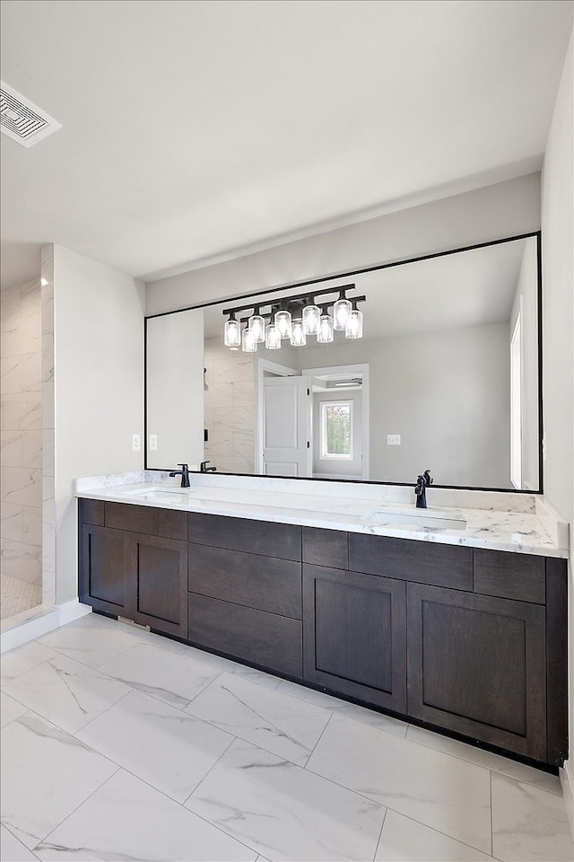 bathroom featuring walk in shower and vanity