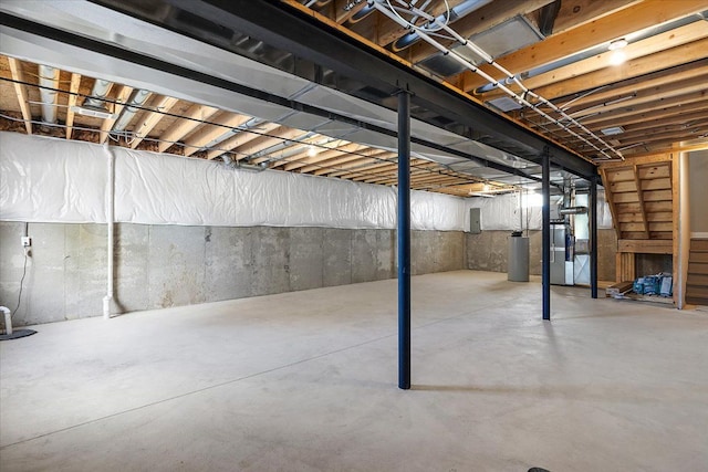 basement featuring heating unit and electric panel