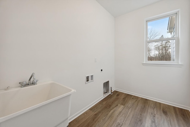 washroom featuring hookup for an electric dryer, dark hardwood / wood-style floors, sink, and hookup for a washing machine