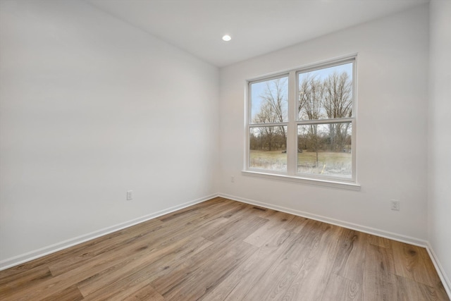 spare room featuring light wood-type flooring