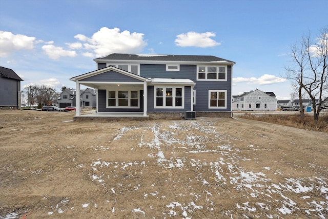 snow covered house featuring a patio