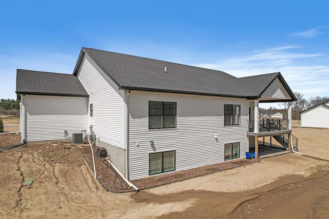 rear view of house with a wooden deck