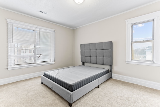 bedroom with carpet floors and ornamental molding