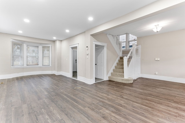 unfurnished living room with hardwood / wood-style flooring